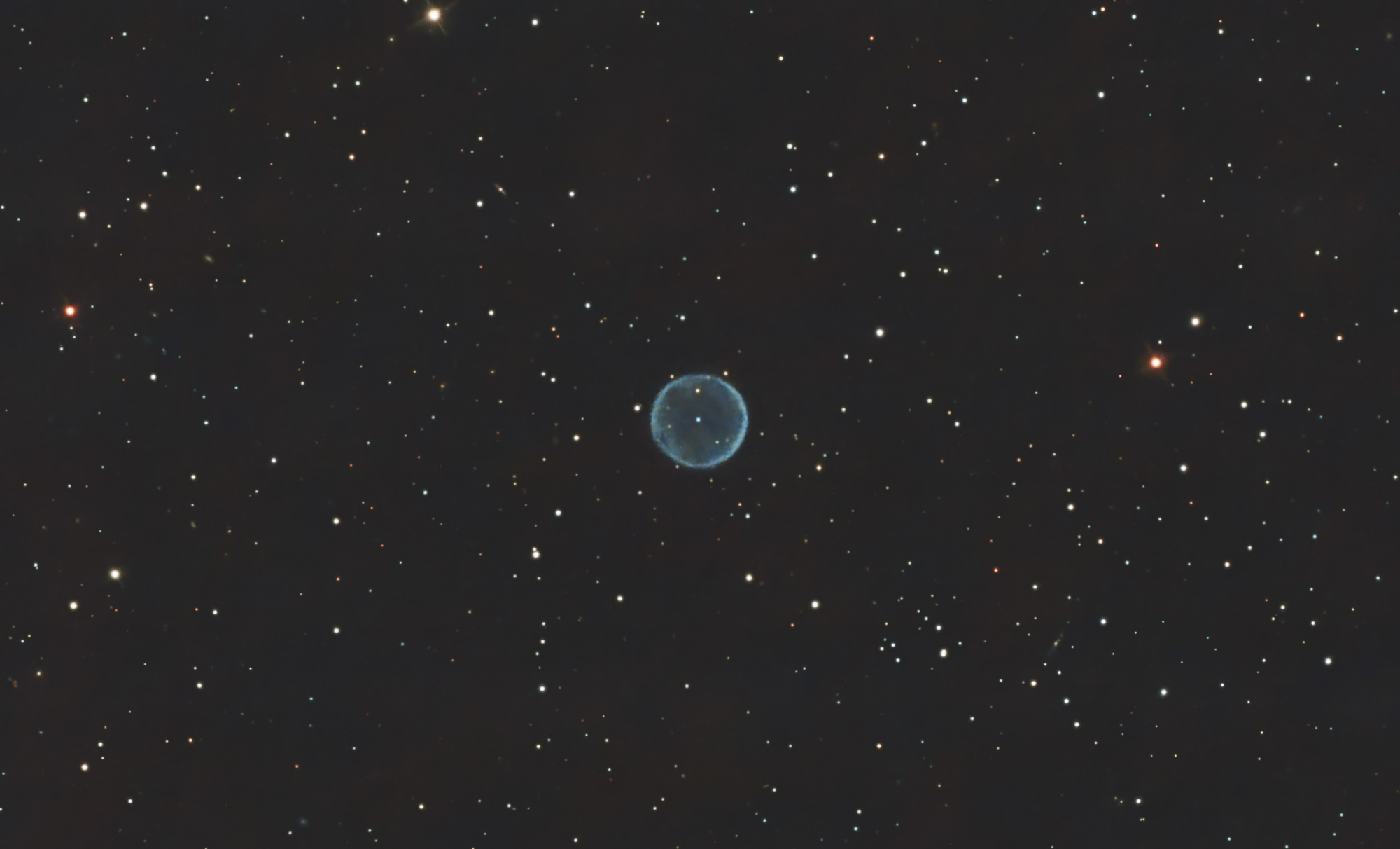 Abell 39, the 39th entry in the catalog of large nebulae discovered by George Abell in 1966, is a beautiful example of a planetary nebula.